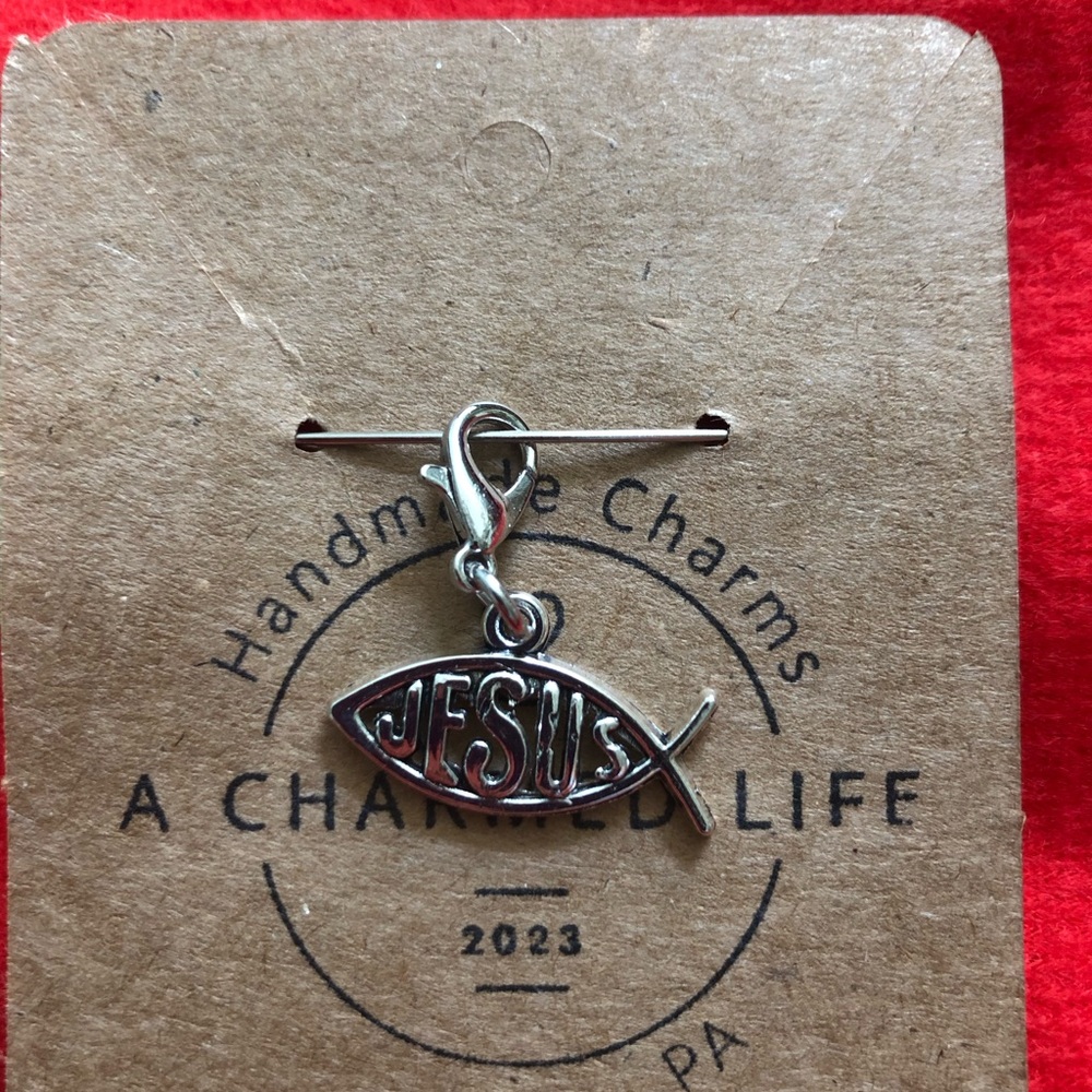 Silver “Jesus” Zipper Pull.